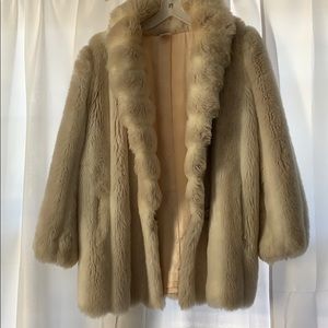 White and beige faux fur coat